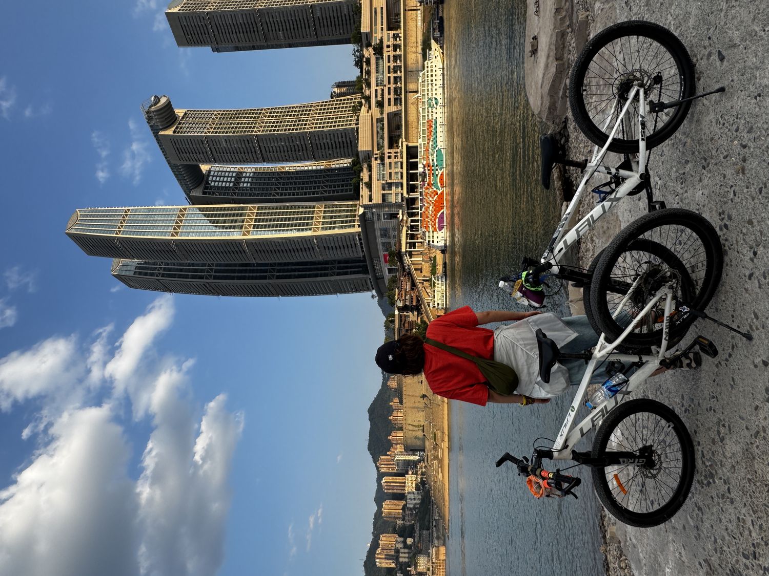 Cyclist and bikes beside Raffles City